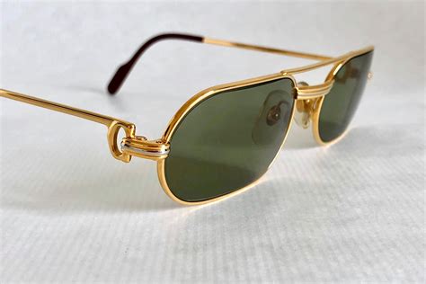 cartier trinity gold metal glasses|gold cartier glasses with diamonds.